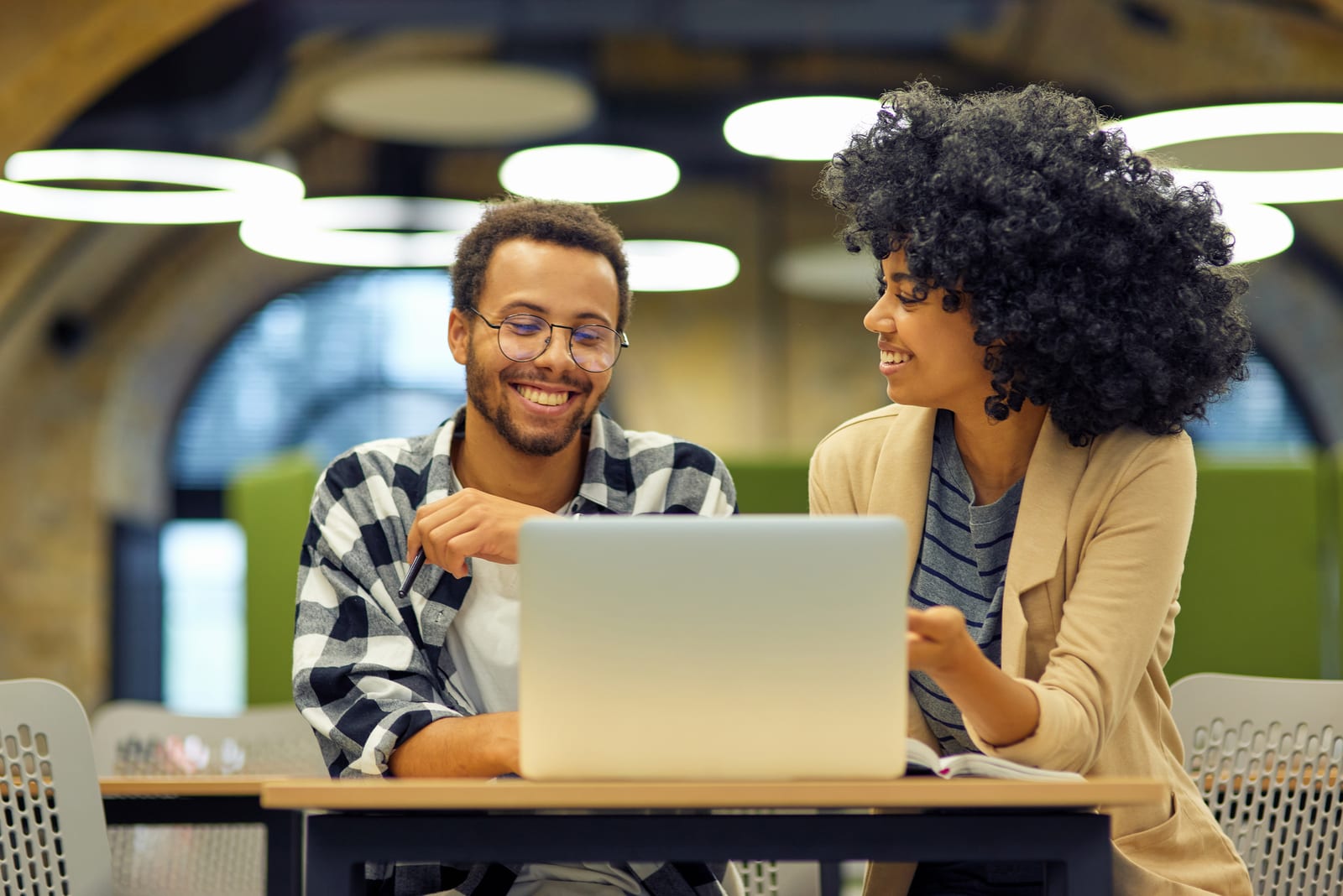 Students and researchers collaborating in a technology workspace