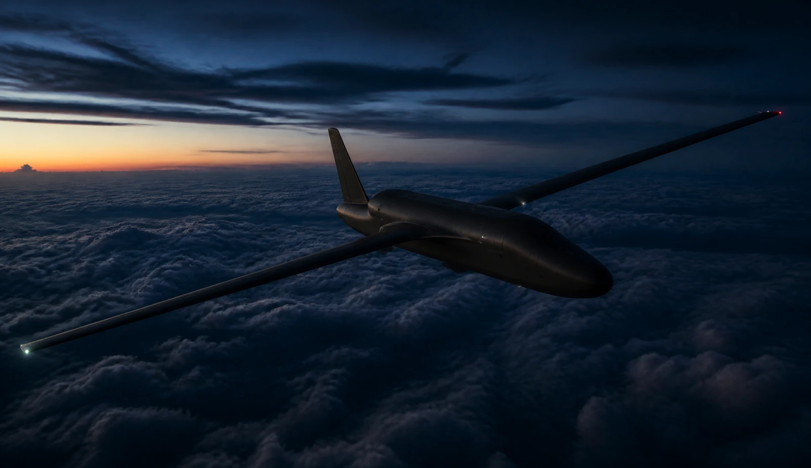 Long-wing autonomous aircraft flying above a cloud deck at dusk.